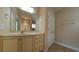 Bathroom with neutral colors, tiled floors, spacious vanity and bright lighting at 1224 Checkerberry St., Longs, SC 29568