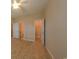 Bedroom featuring a walk in closet, and an ensuite bathroom with tile floors at 1224 Checkerberry St., Longs, SC 29568