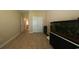The bonus room features tile flooring, a closet, and a large fish tank, perfect for relaxing at 1224 Checkerberry St., Longs, SC 29568