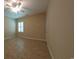 A well-lit bonus room with tile flooring, a ceiling fan and a window to allow for natural light at 1224 Checkerberry St., Longs, SC 29568