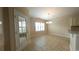 Bright dining area features tile floors and a modern chandelier at 1224 Checkerberry St., Longs, SC 29568