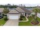Attractive single-story home boasting a two-car garage, inviting entrance, and landscaped front yard at 1224 Checkerberry St., Longs, SC 29568