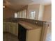 Kitchen with light cabinetry, granite countertops, a breakfast bar, and tile floors at 1224 Checkerberry St., Longs, SC 29568
