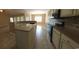 This is a kitchen with granite countertop, stainless steel appliances, a large kitchen island, and tiled floors at 1224 Checkerberry St., Longs, SC 29568