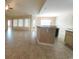 Bright living room featuring tile floors, many windows, and an open floor plan at 1224 Checkerberry St., Longs, SC 29568
