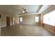 Spacious main bedroom with tile floors, tray ceilings, and bright windows at 1224 Checkerberry St., Longs, SC 29568
