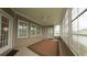 Bright and airy enclosed patio with a ceiling fan, plenty of natural light, and tranquil outdoor views at 1224 Checkerberry St., Longs, SC 29568