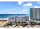 View of condo complex overlooking ocean and parking at 1310 N Waccamaw Dr. # 208, Garden City Beach, SC 29576