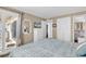 Comfortable bedroom with bed, dresser, tv, closet, and access to an en suite bathroom and balcony at 1310 N Waccamaw Dr. # 208, Garden City Beach, SC 29576