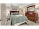 Classic bedroom featuring a queen bed, wooden furnishings, and a neutral color palette at 1310 N Waccamaw Dr. # 208, Garden City Beach, SC 29576