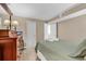 Bedroom with queen bed, side table, lamp, wooden dresser, and soft lighting at 1310 N Waccamaw Dr. # 208, Garden City Beach, SC 29576