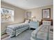 Cozy bedroom with two twin beds, side table, and a bright window with a great view at 1310 N Waccamaw Dr. # 208, Garden City Beach, SC 29576