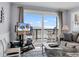 Living room featuring ocean view, neutral walls, and access to oceanfront balcony at 1310 N Waccamaw Dr. # 208, Garden City Beach, SC 29576