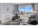 Bright living room with comfy seating and access to a balcony with ocean views at 1310 N Waccamaw Dr. # 208, Garden City Beach, SC 29576