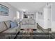 Bright living room with luxury vinyl plank flooring and smooth ceilings at 1310 N Waccamaw Dr. # 208, Garden City Beach, SC 29576