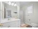 Well-lit bathroom featuring a glass shower, single sink vanity, and neutral color palette at 146 Georges Bay Rd., Surfside Beach, SC 29575