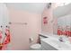 Pink bathroom featuring a shower with flamingo-themed curtains and a single sink vanity at 146 Georges Bay Rd., Surfside Beach, SC 29575