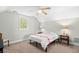 Cozy bedroom with a ceiling fan, carpet, and a window for natural light at 146 Georges Bay Rd., Surfside Beach, SC 29575