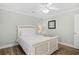Cozy bedroom with a white bed frame, neutral decor, and a ceiling fan at 146 Georges Bay Rd., Surfside Beach, SC 29575