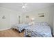 Bright bedroom with two beds, wood floors, and adjacent access to an ensuite bathroom at 146 Georges Bay Rd., Surfside Beach, SC 29575