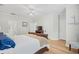 Spacious bedroom with wood floors, crown molding, and a ceiling fan at 146 Georges Bay Rd., Surfside Beach, SC 29575