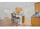 Partial view of an open-concept kitchen with bar seating and access to the living space at 146 Georges Bay Rd., Surfside Beach, SC 29575
