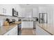Modern kitchen featuring white cabinets, granite countertops, stainless steel appliances, and a subway tile backsplash at 146 Georges Bay Rd., Surfside Beach, SC 29575