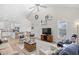 Bright, open-concept living room featuring modern decor, vaulted ceiling, and seamless flow to the kitchen at 146 Georges Bay Rd., Surfside Beach, SC 29575