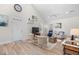 Comfortable living room with vaulted ceilings, a fan, and stylish decor featuring neutral tones and artwork at 146 Georges Bay Rd., Surfside Beach, SC 29575