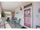 Inviting front porch with outdoor seating, decorative wreath on the front door, and charming decor at 146 Georges Bay Rd., Surfside Beach, SC 29575