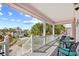 Relaxing covered front porch with comfortable seating area and views of neighborhood at 146 Georges Bay Rd., Surfside Beach, SC 29575