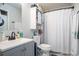 Bathroom with single sink vanity, toilet, and combination shower and bathtub at 1460 Blue Tree Ct. # E, Myrtle Beach, SC 29588