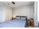 Bedroom featuring a large closet, queen bed, and an end table at 1460 Blue Tree Ct. # E, Myrtle Beach, SC 29588