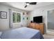 Bedroom with queen bed, TV, ceiling fan and large window at 1460 Blue Tree Ct. # E, Myrtle Beach, SC 29588