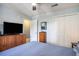 Bedroom with queen size bed, TV, a closet and ceiling fan at 1460 Blue Tree Ct. # E, Myrtle Beach, SC 29588