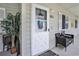 Covered entryway with exterior seating, a storm door, and a fun welcome mat at 1460 Blue Tree Ct. # E, Myrtle Beach, SC 29588