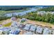 Beautiful aerial view of a waterfront community with colorful homes and serene water views and lush green trees at 1545 Coastal Cove Ln, Calabash, NC 28467