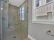 Modern bathroom with tiled shower stall and glass door at 1545 Coastal Cove Ln, Calabash, NC 28467