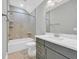 Bathroom features a marble vanity top and tiled shower and floors at 1545 Coastal Cove Ln, Calabash, NC 28467