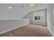 Lofted bedroom is naturally bright with a large window at 1545 Coastal Cove Ln, Calabash, NC 28467