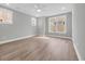 Bright bedroom has two windows and vinyl wood-look flooring at 1545 Coastal Cove Ln, Calabash, NC 28467
