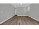 Bedroom features wood look floors and a large window at 1545 Coastal Cove Ln, Calabash, NC 28467