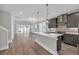 Open concept kitchen featuring a center island, pendant lighting, and stainless-steel appliances at 1545 Coastal Cove Ln, Calabash, NC 28467