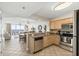 View of the kitchen and living area with access to an ocean view at 1625 S Ocean Blvd. # 309, North Myrtle Beach, SC 29582