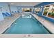 Indoor swimming pool area with lounge chairs and natural light at 1625 S Ocean Blvd. # 309, North Myrtle Beach, SC 29582
