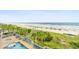 Resort-style pool with lush tropical landscaping offers the perfect oasis for relaxation and beach access at 1625 S Ocean Blvd. # 309, North Myrtle Beach, SC 29582