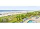 Inviting poolside with lounge chairs and tropical foliage for a relaxing beachfront experience at 1625 S Ocean Blvd. # 309, North Myrtle Beach, SC 29582