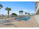 Large swimming pool surrounded by lush greenery and comfortable lounge chairs at 1625 S Ocean Blvd. # 309, North Myrtle Beach, SC 29582