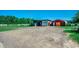 The property includes storage sheds and a barn, offering practical solutions for equipment and animal sheltering at 181 Halfway Rd., Nichols, SC 29581