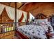 Charming bedroom with wood walls, and peaked roof, featuring a bed on a lofted area at 181 Halfway Rd., Nichols, SC 29581